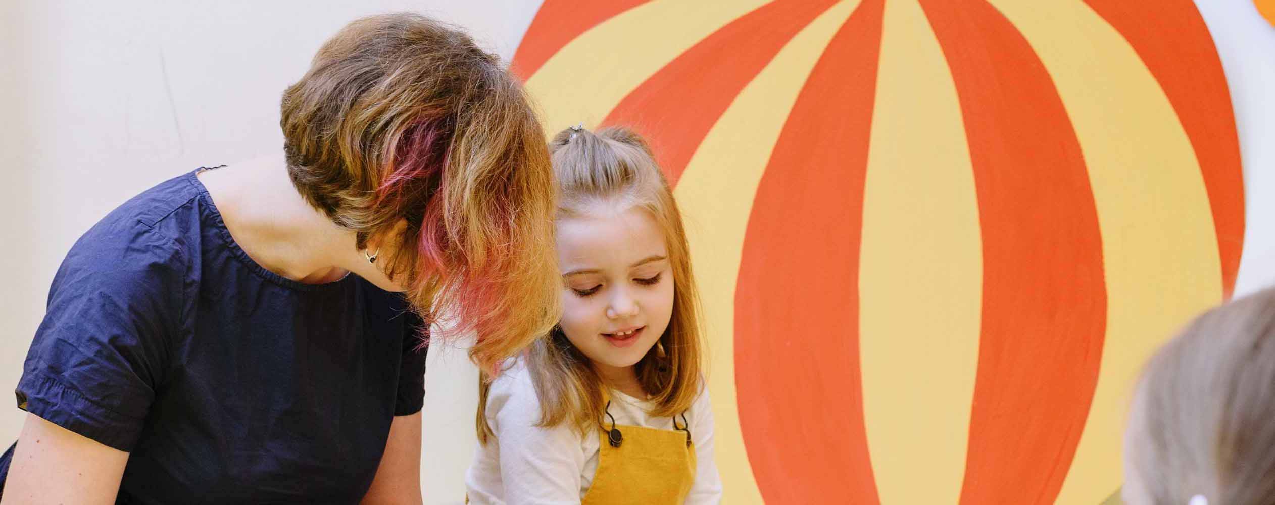 smiling child sat with adult