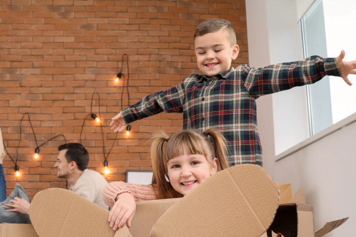 children playing in cardboard boxes